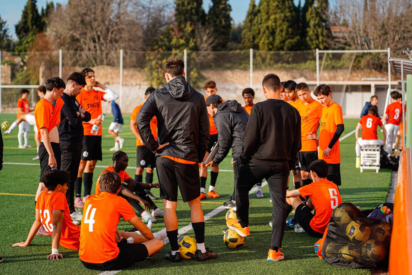 Coaches with the players